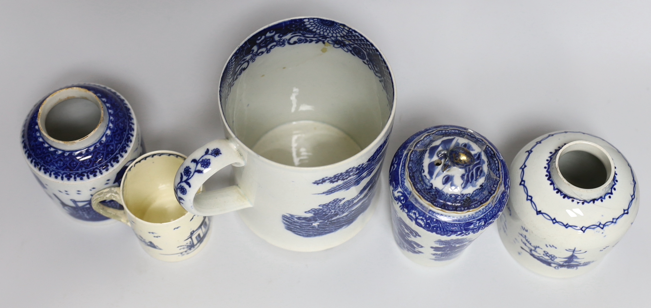 A group of mixed late 18th/early 19th century blue and white pearlware etc. tea canisters and mugs, the largest 14cm high
